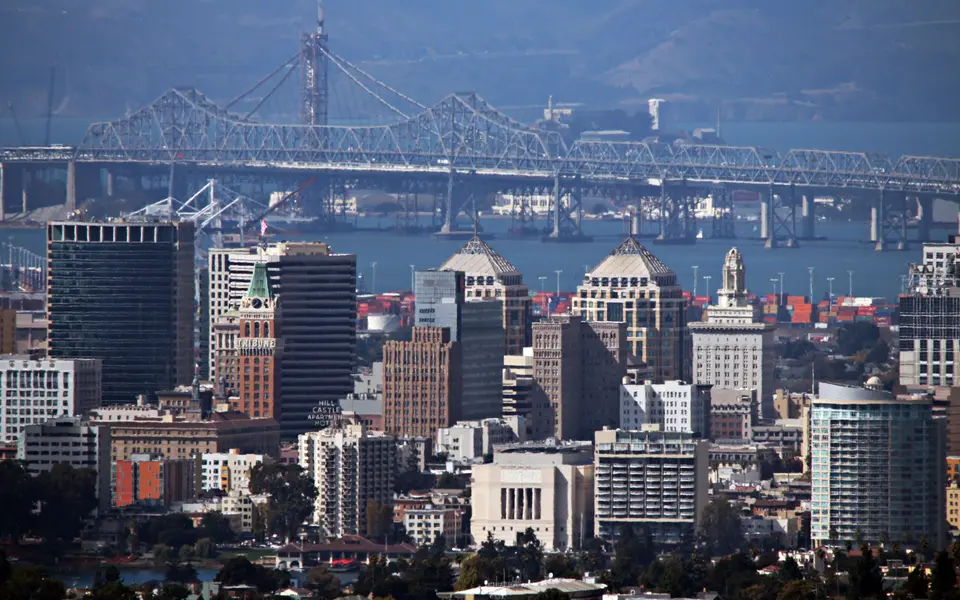 Oakland skyline with the San Francisco–Oakland Bay Bridge in the background